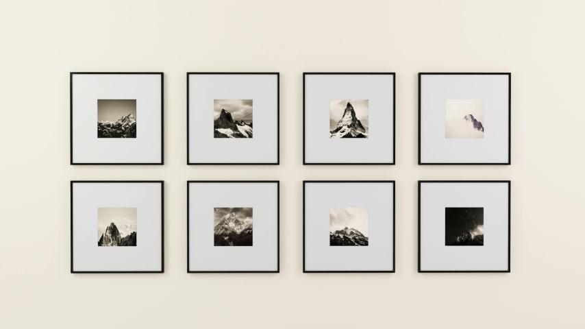 A wall with printed artwork.