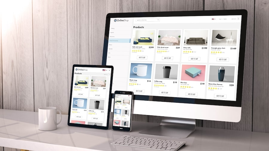 A computer screen, a tablet, and a phone with a store catalog on the screens.