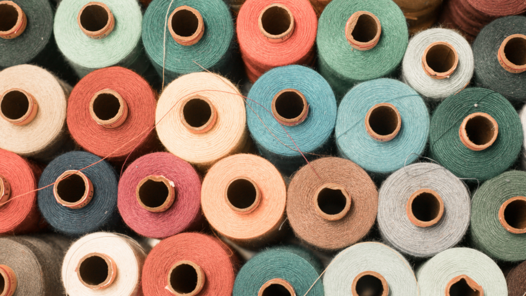 Colorful cotton threads standing next to each other.